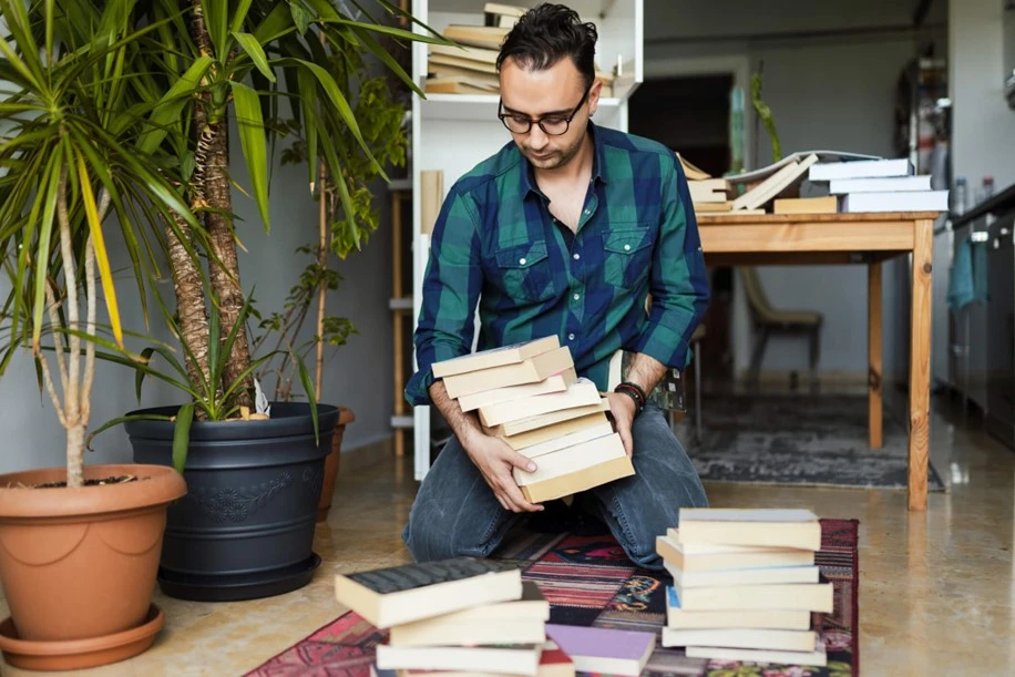 Man decluttering is house